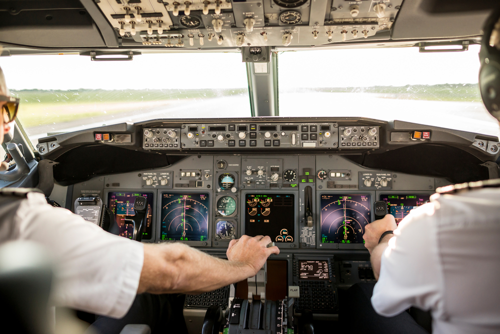 captain and first officer in flight deck