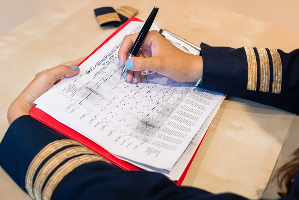 pilot preparing flight documentation