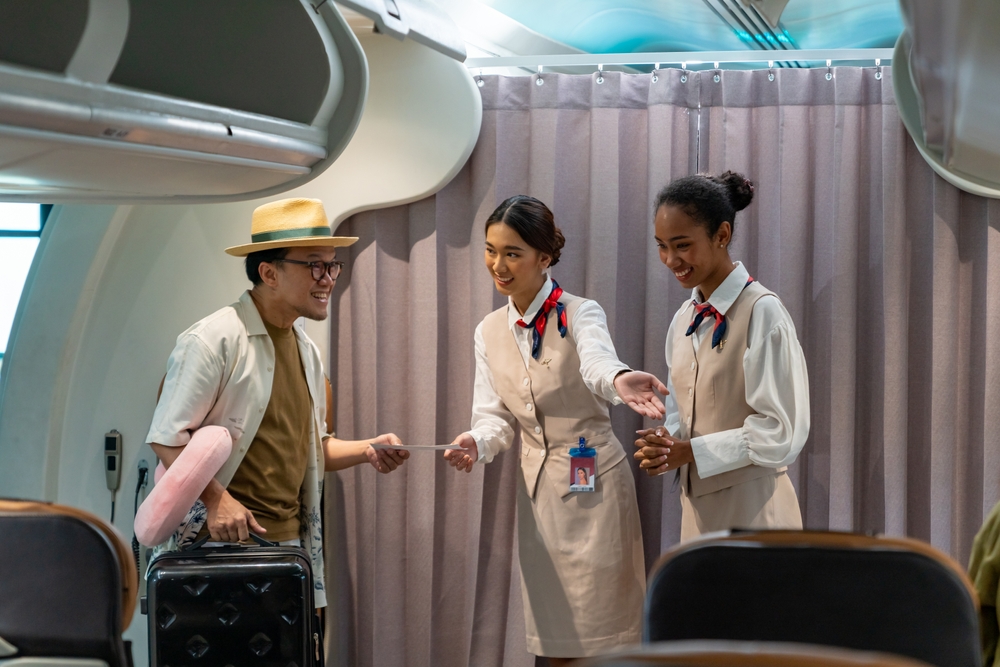 flight attendant checking boarding pass